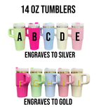 a collection of 14 oz tumblers in various colors, including pink, green, blue, and white, with the text "14 OZ TUMBLERS" and "ENGRAVES TO SILVER" and "ENGRAVES TO GOLD" indicating that the tumblers can be engraved with letters or designs.