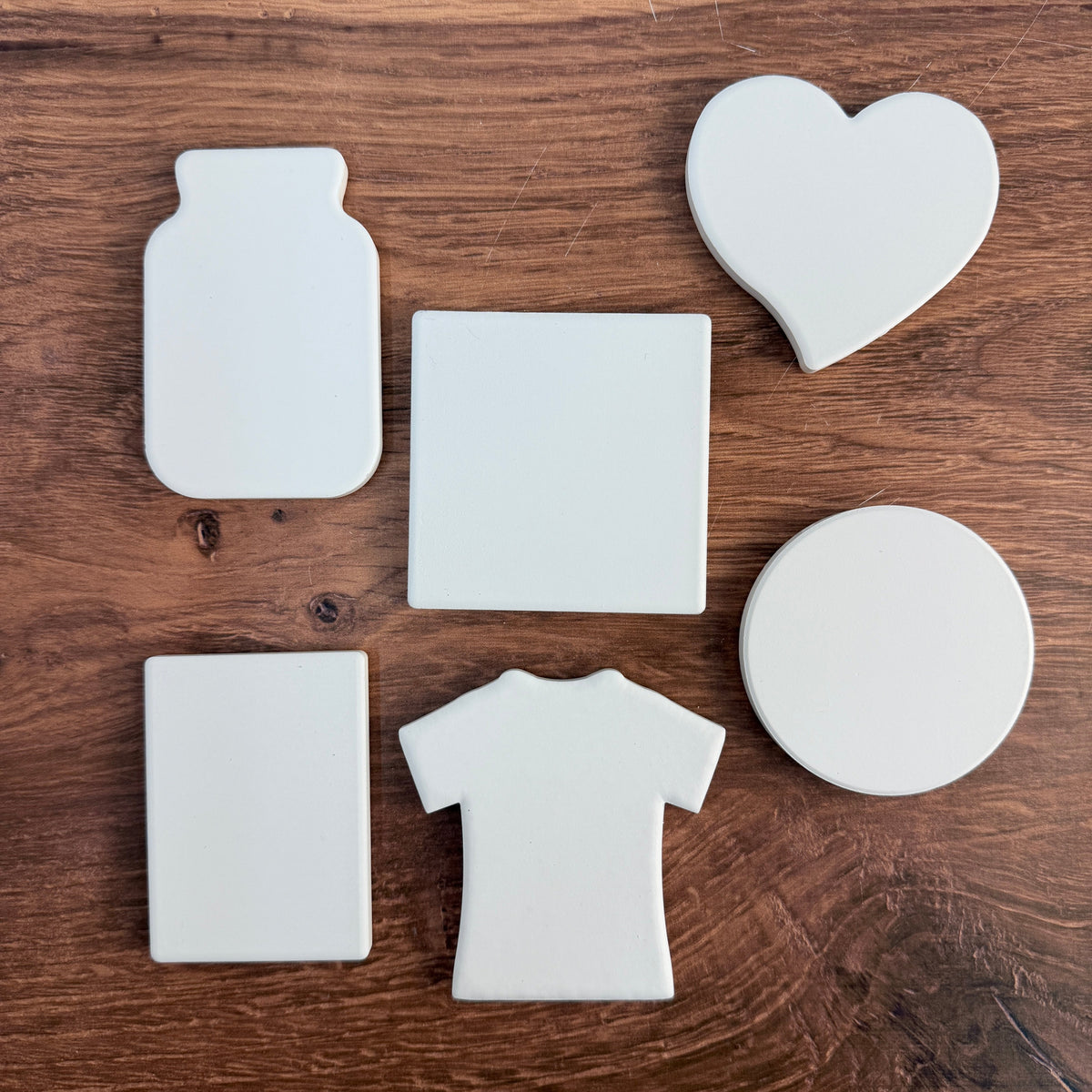 Blank ceramic magnet shapes before printing